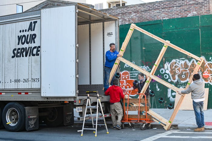 Moving service professionals carrying out a job